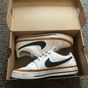 Nike Women's White Sneakers with Black and Gold Details